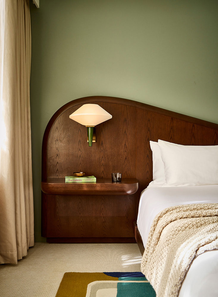 Luxurious wood headboard and bed with modern lamp and side table